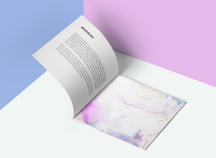 Square booklet Open booklet with pastel abstract design.